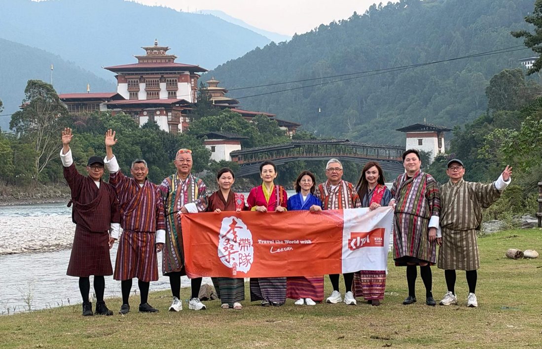 Tourists in Bhutan with banner