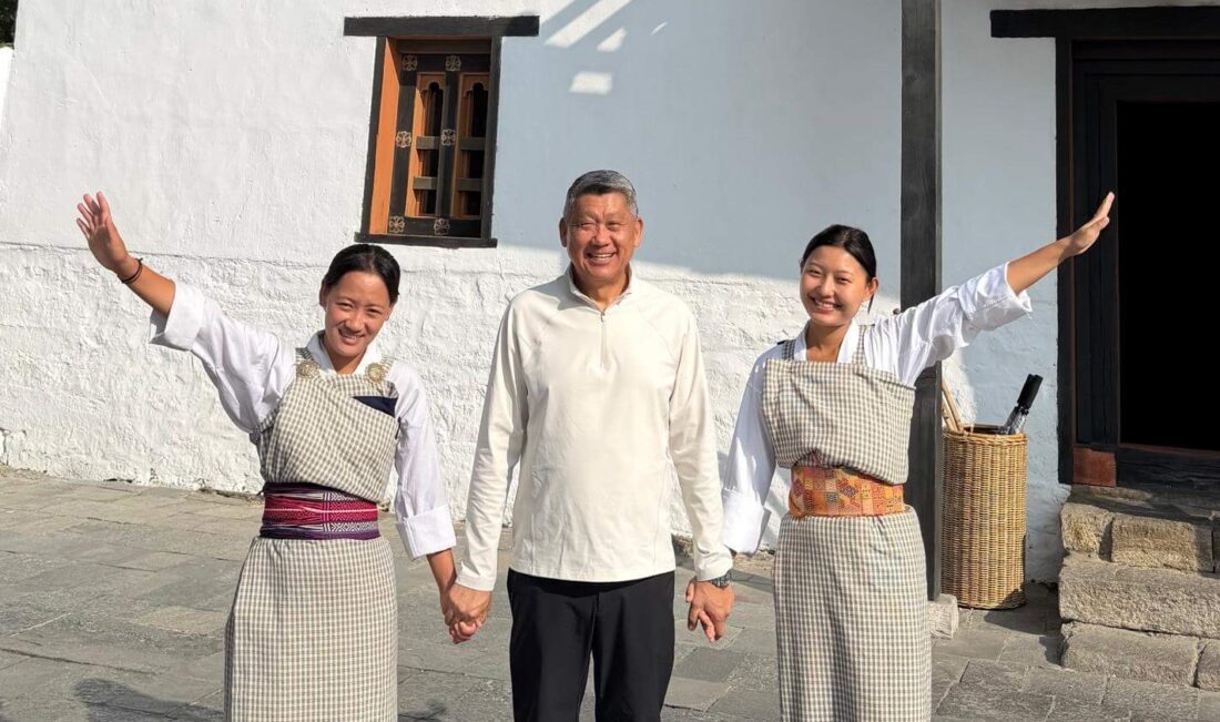 Man with women in traditional dress