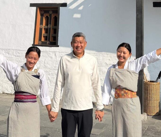 Man with women in traditional dress