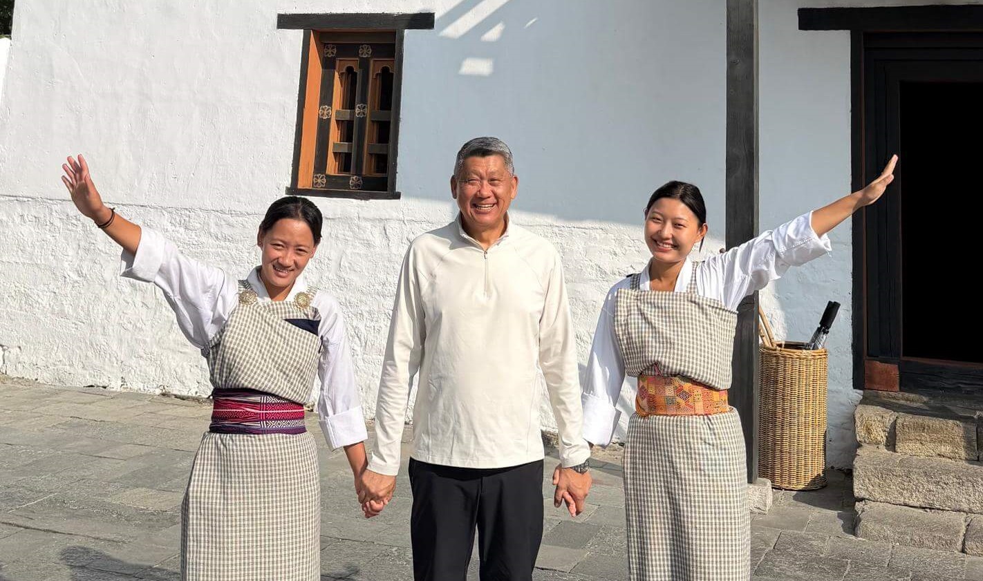Man with women in traditional dress