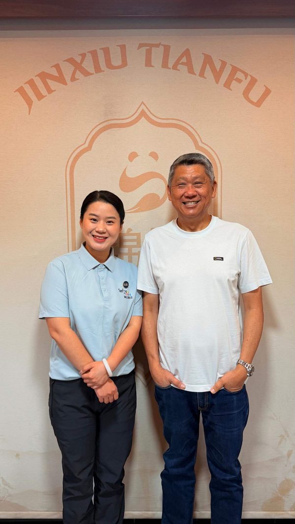 Two people posing together.
