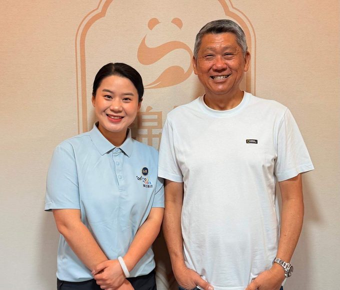 Two people posing together.