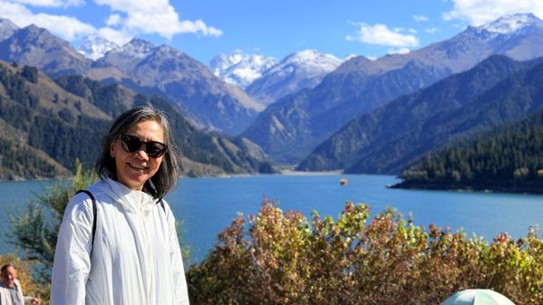 Woman at a mountain lake