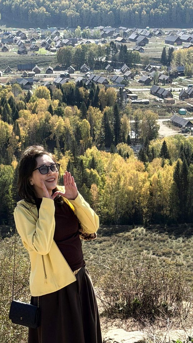 Woman enjoying autumn village view