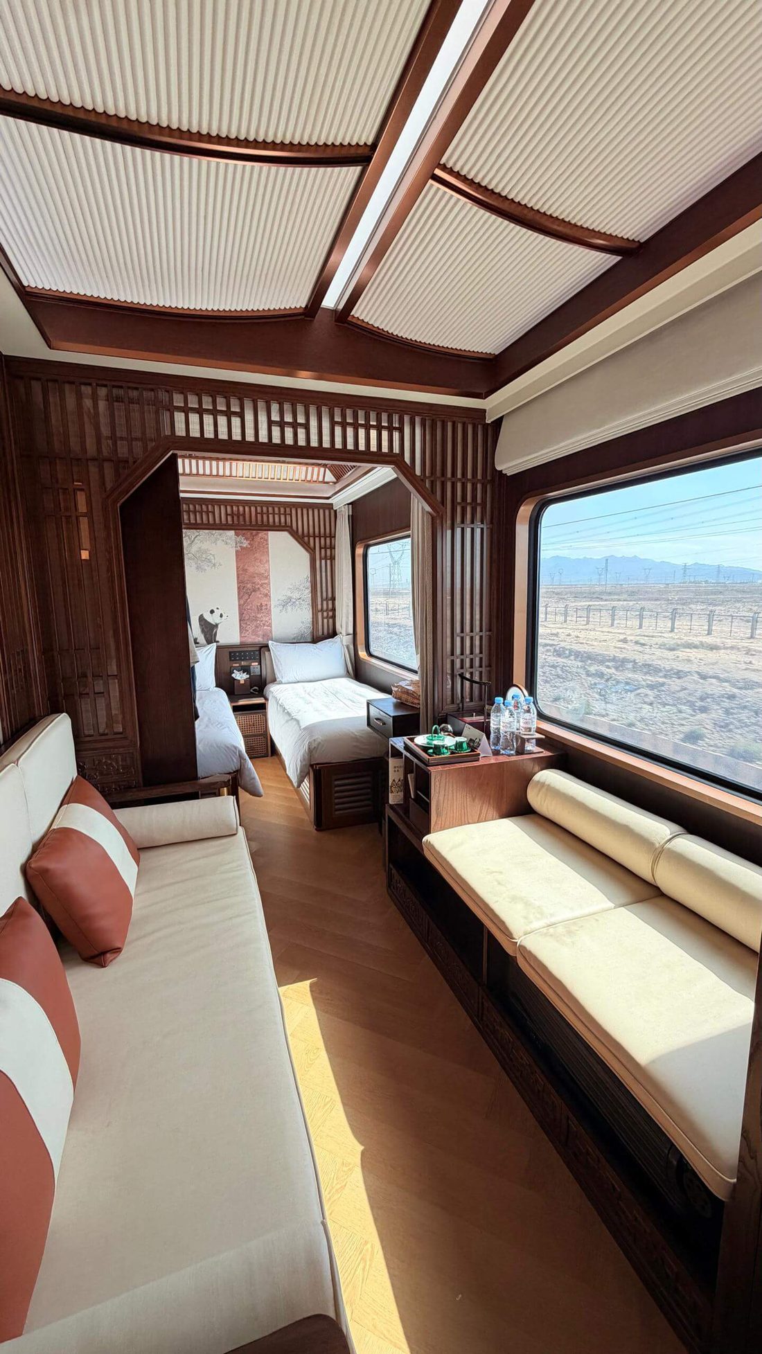 Luxury train cabin with beds.