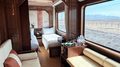 Luxury train cabin with beds.