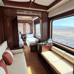 Luxury train cabin with beds.